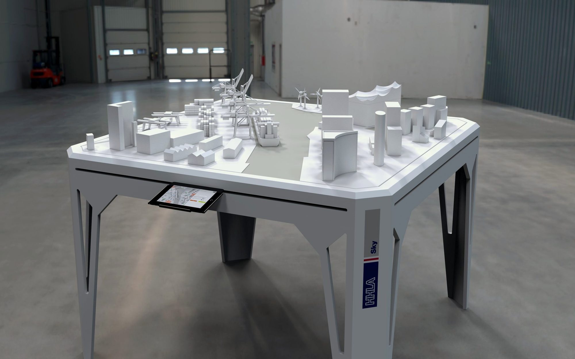 Der Abstimmungstisch mit weißem Stadtmodell in einer Halle